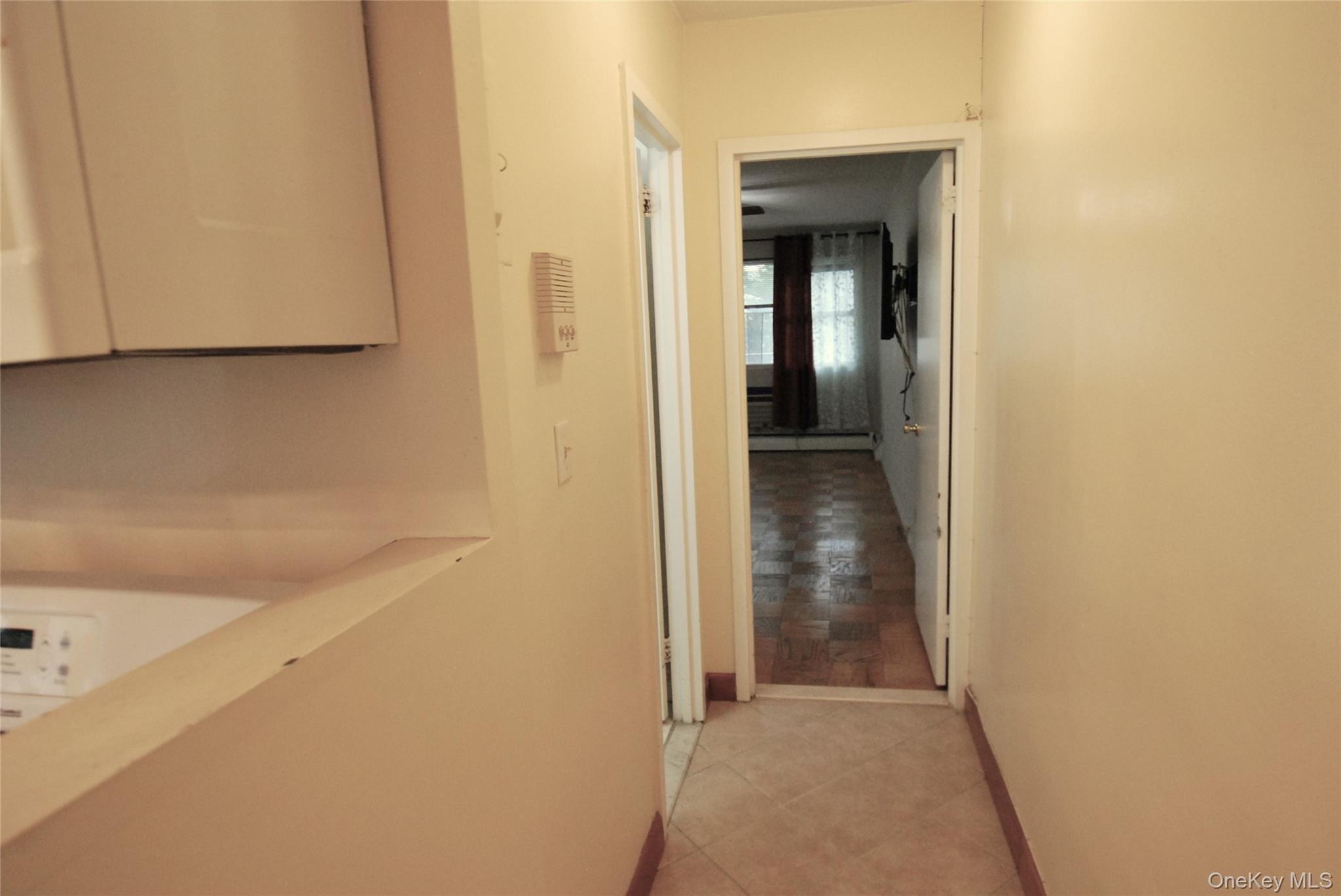 1523 Central Park Avenue, Unit 5F Yonkers, NY 10710 - Photo 8 of 20 a view of a hallway with wooden floor