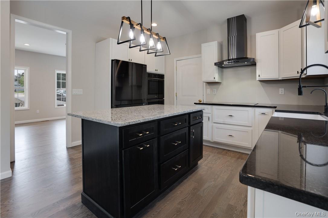 991 Freedom Road Pleasant Valley, NY 12569 - Photo 6 of 23 a kitchen with stainless steel appliances kitchen island granite countertop a refrigerator and a stove top oven