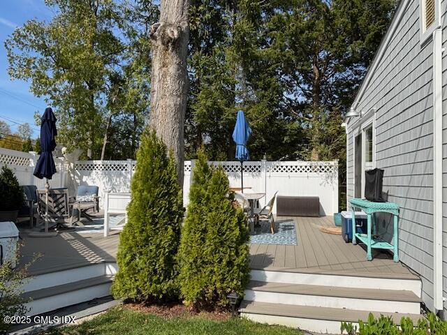 8 Perry Place Riverside, CT 06878 - Photo 20 of 26 a view of a patio with table and chairs potted plants and large tree