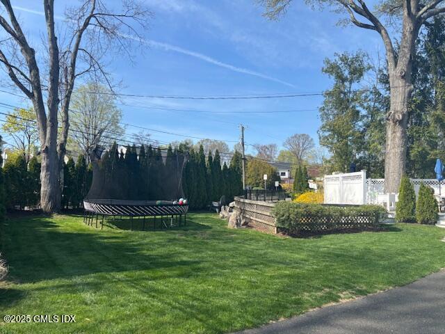 8 Perry Place Riverside, CT 06878 - Photo 21 of 26 a front view of a house with garden and a tree