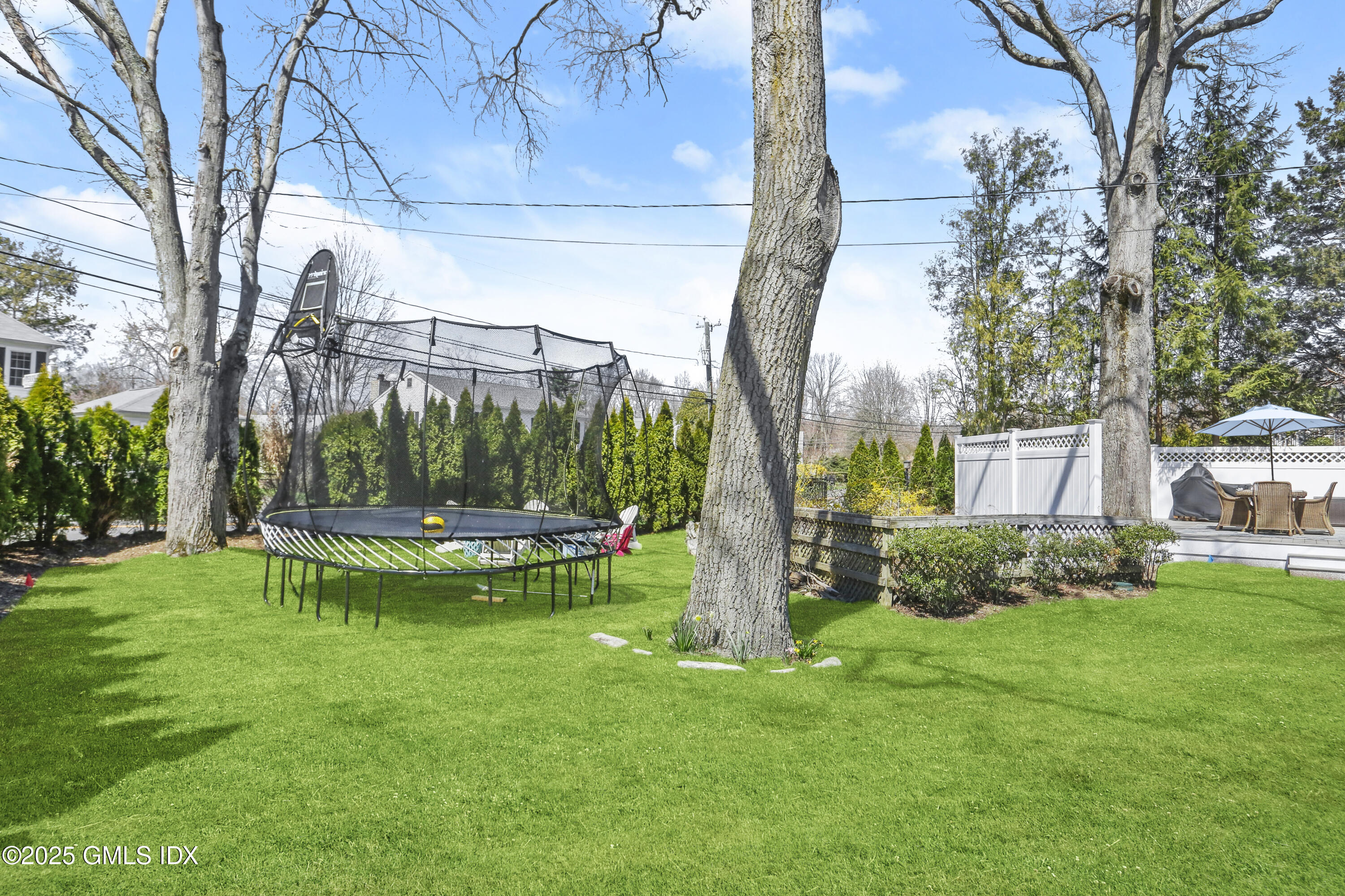 8 Perry Place Riverside, CT 06878 - Photo 22 of 26 a view of a table and chairs in the garden
