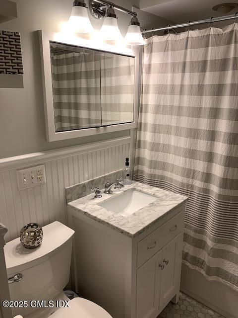 8 Perry Place Riverside, CT 06878 - Photo 10 of 26 a bathroom with a sink a toilet and shower curtain