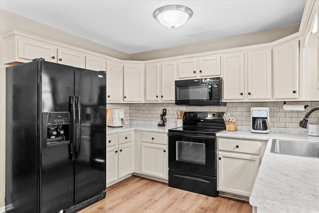 2326 Waring Road Northwest Dalton, GA 30721 - Photo 15 of 41 a kitchen with a refrigerator stove and microwave