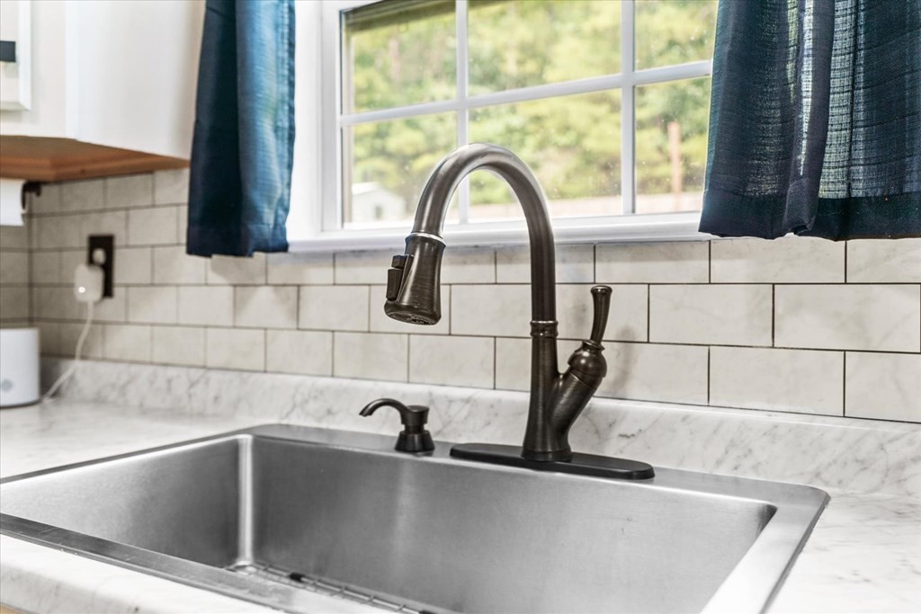 2326 Waring Road Northwest Dalton, GA 30721 - Photo 19 of 41 a view of a faucet a sink and a window