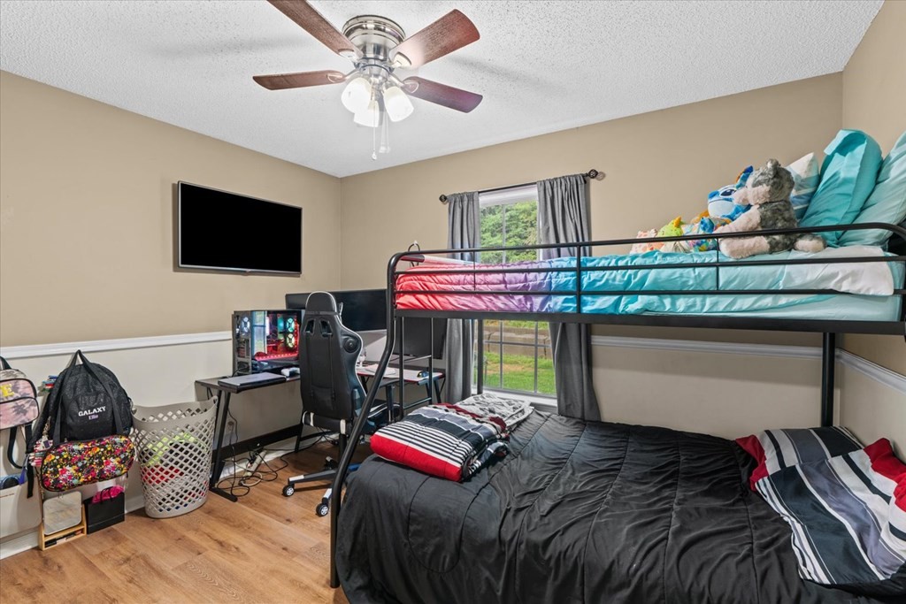 2326 Waring Road Northwest Dalton, GA 30721 - Photo 28 of 41 a bedroom with a bed and a tv
