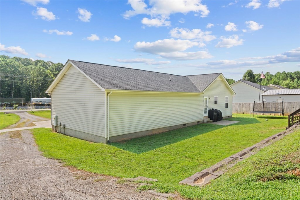 2326 Waring Road Northwest Dalton, GA 30721 - Photo 33 of 41 a view of a house with a backyard
