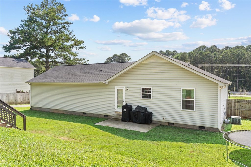 2326 Waring Road Northwest Dalton, GA 30721 - Photo 34 of 41 a backyard of a house with table and chairs