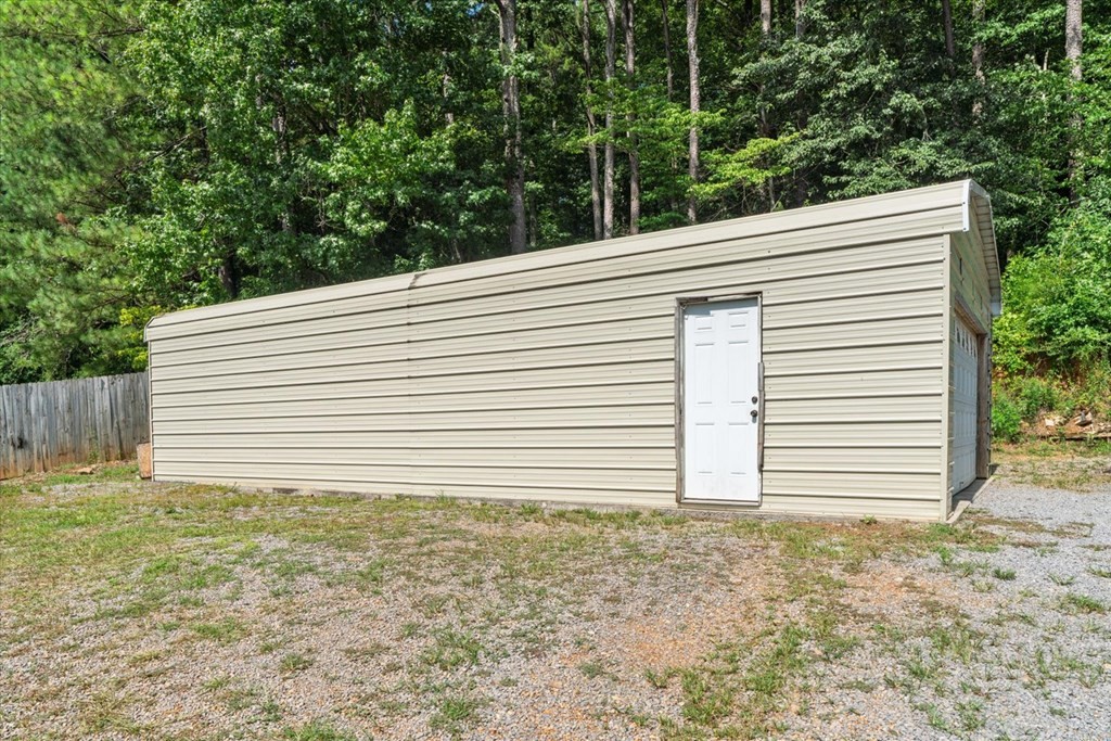 2326 Waring Road Northwest Dalton, GA 30721 - Photo 37 of 41 a view of a house with a backyard