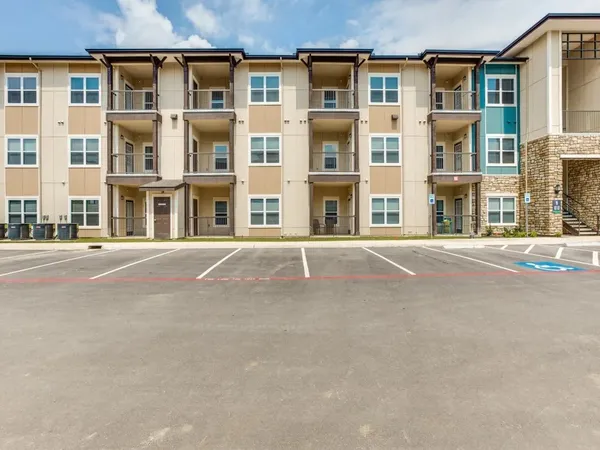 a front view of a building with a street