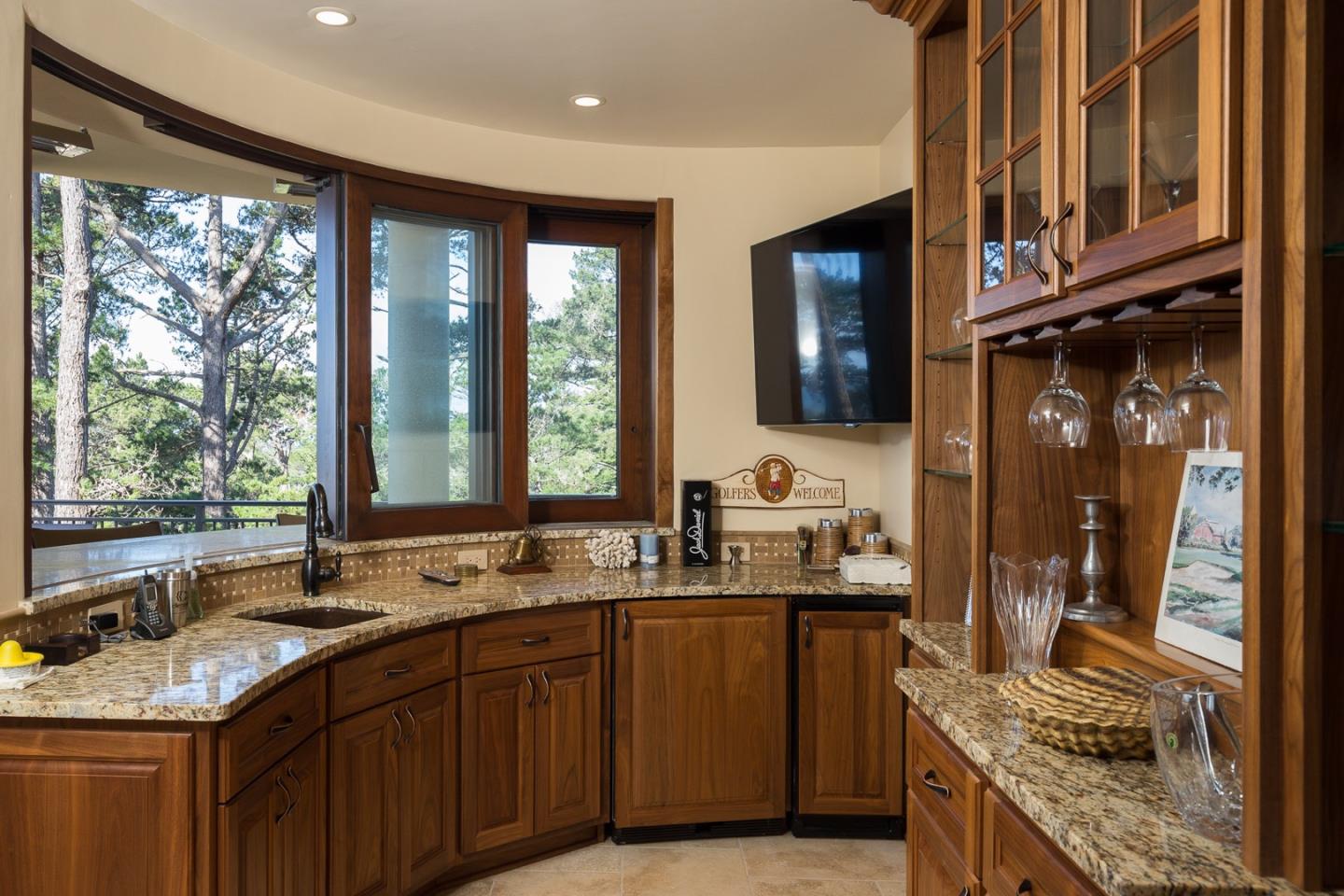 3164 Palmero Way Pebble Beach, CA 93953 - Photo 13 of 24 a kitchen with granite countertop a sink and a window