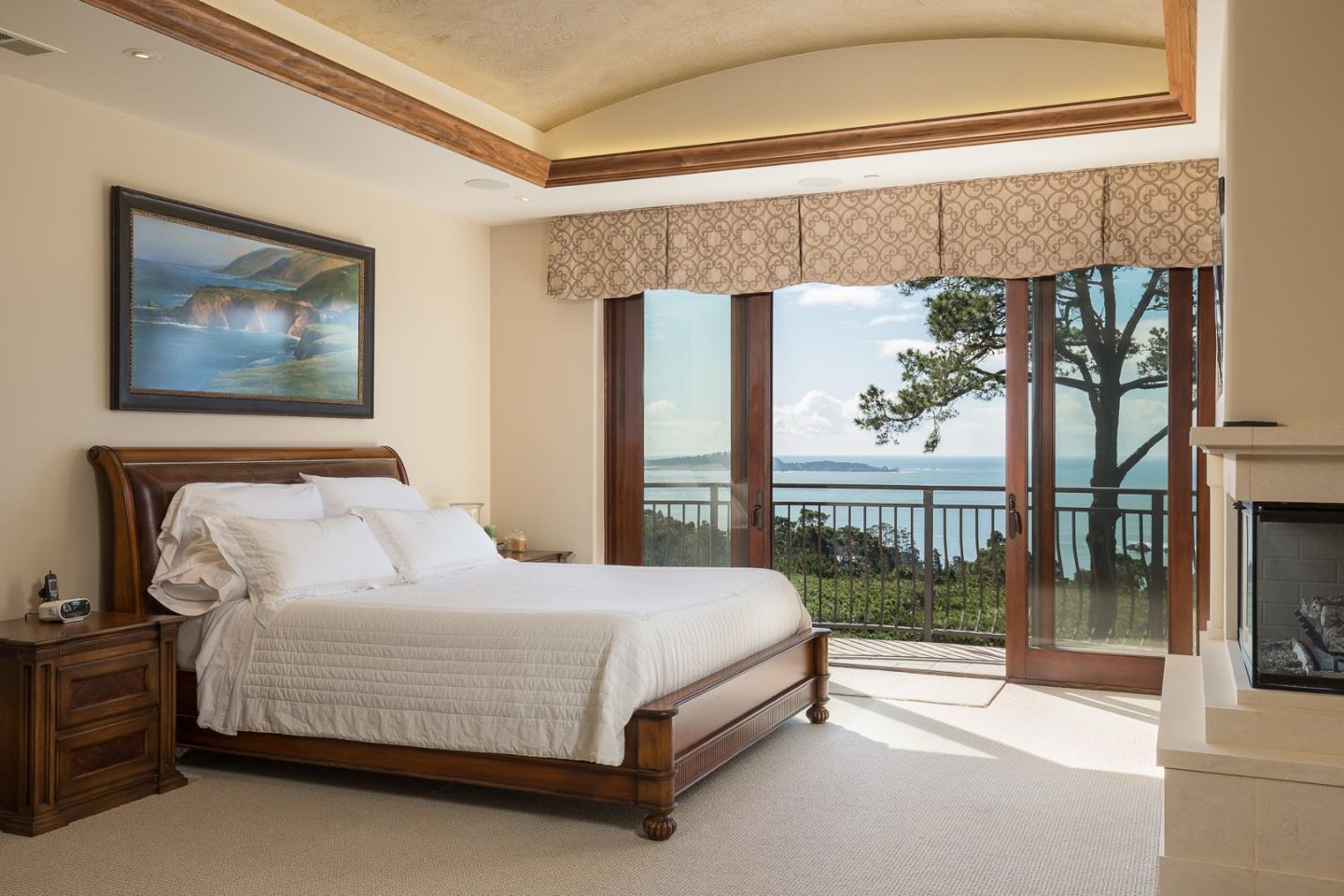 3164 Palmero Way Pebble Beach, CA 93953 - Photo 15 of 24 a bedroom with a bed and a painting on the wall