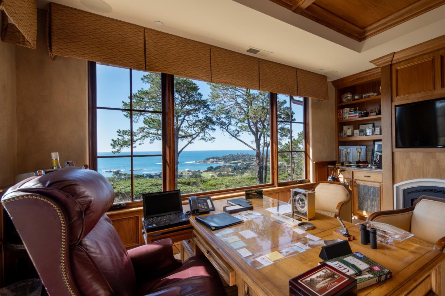 3164 Palmero Way Pebble Beach, CA 93953 - Photo 22 of 24 a living room with furniture a flat screen tv and floor to ceiling window