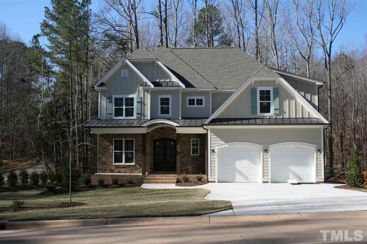 8703 Duckview Court Raleigh, NC 27613 - Photo 1 of 16 a front view of a house with a garden