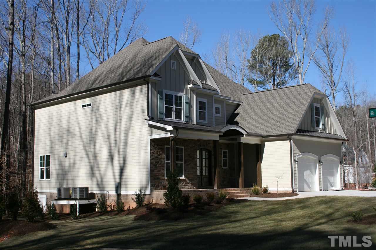 8703 Duckview Court Raleigh, NC 27613 - Photo 2 of 16 a front view of a house with a garden