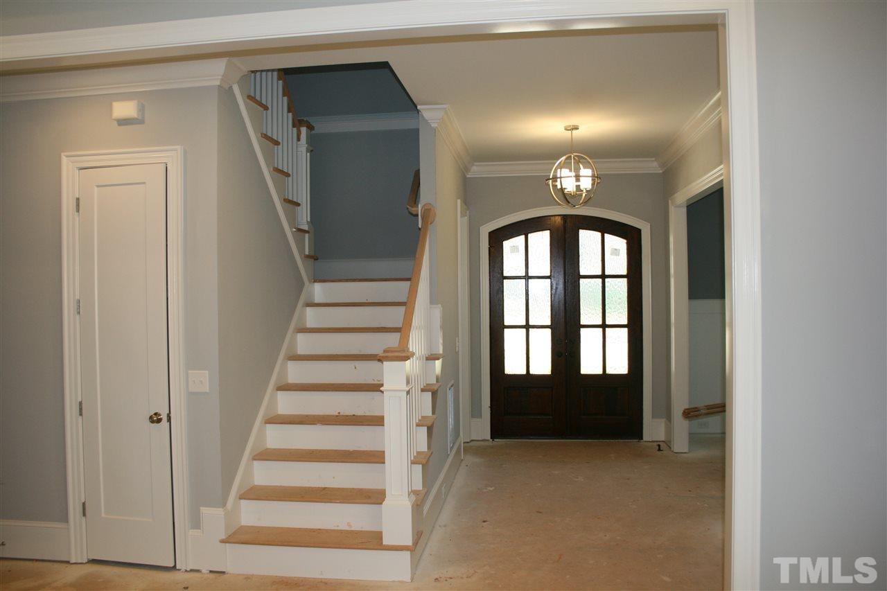 8703 Duckview Court Raleigh, NC 27613 - Photo 10 of 16 a view of an entryway with staircase