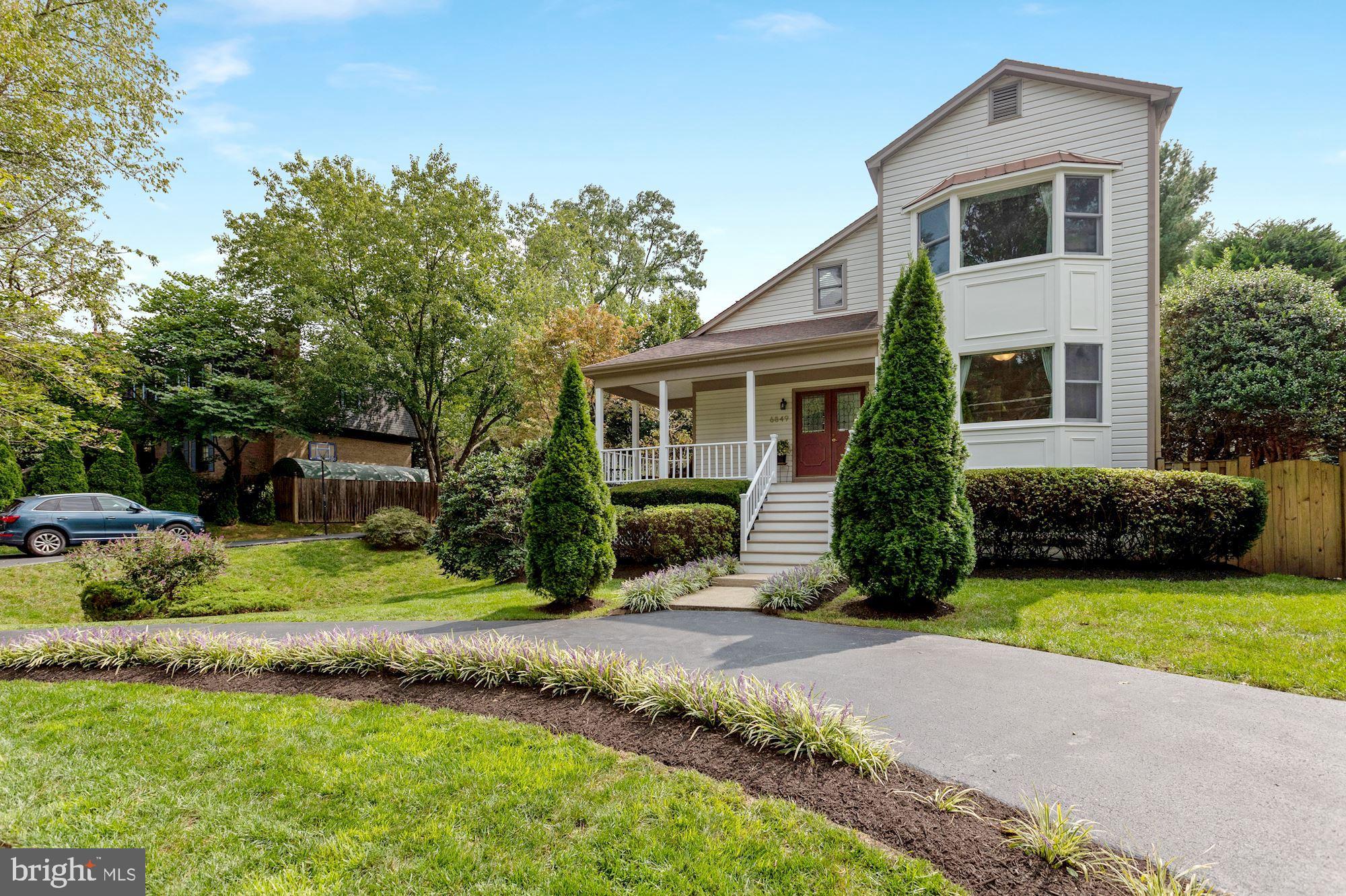 6849 St Albans Road McLean, VA 22101 - Photo 2 of 42 side view of house. Landscaping is beautiful