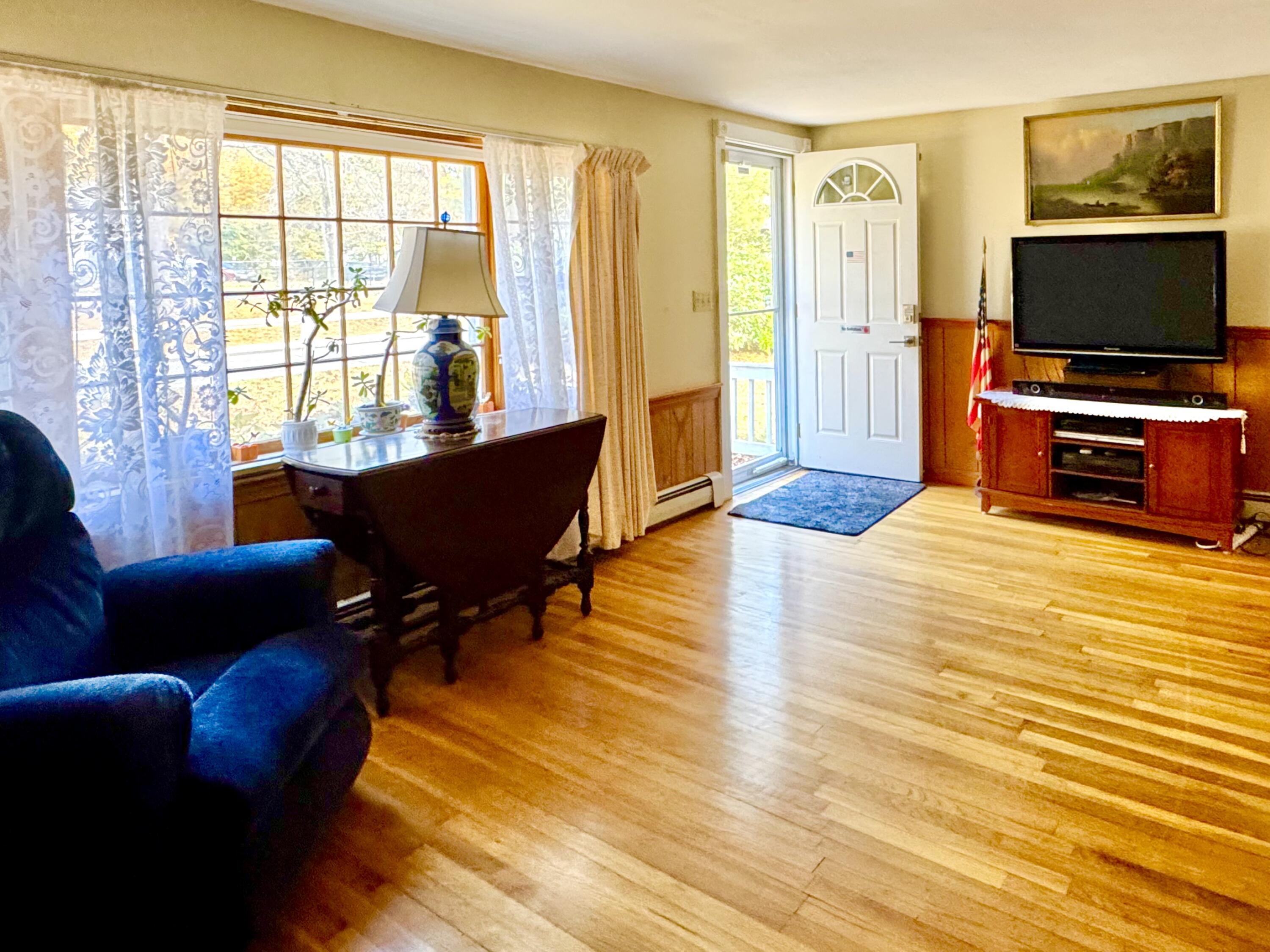 7 Delta Street Hyannis, MA 02601 - Photo 8 of 29 a living room with furniture and a flat screen tv