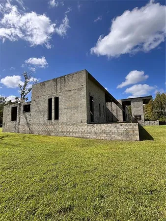 a view of a pool with a yard