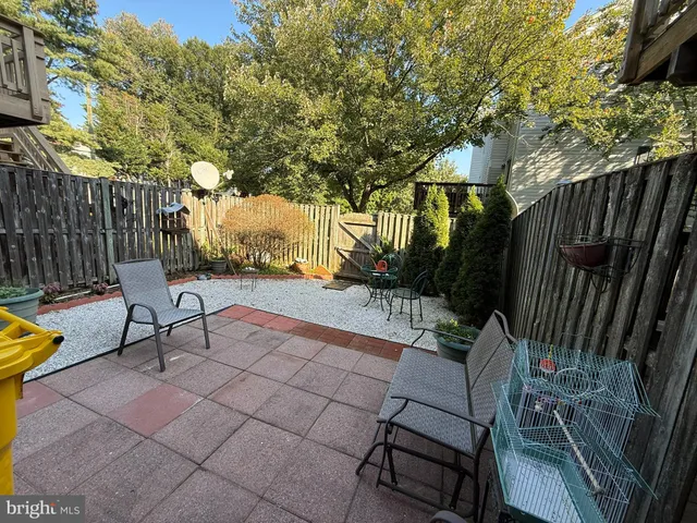 a view of a bench in the backyard