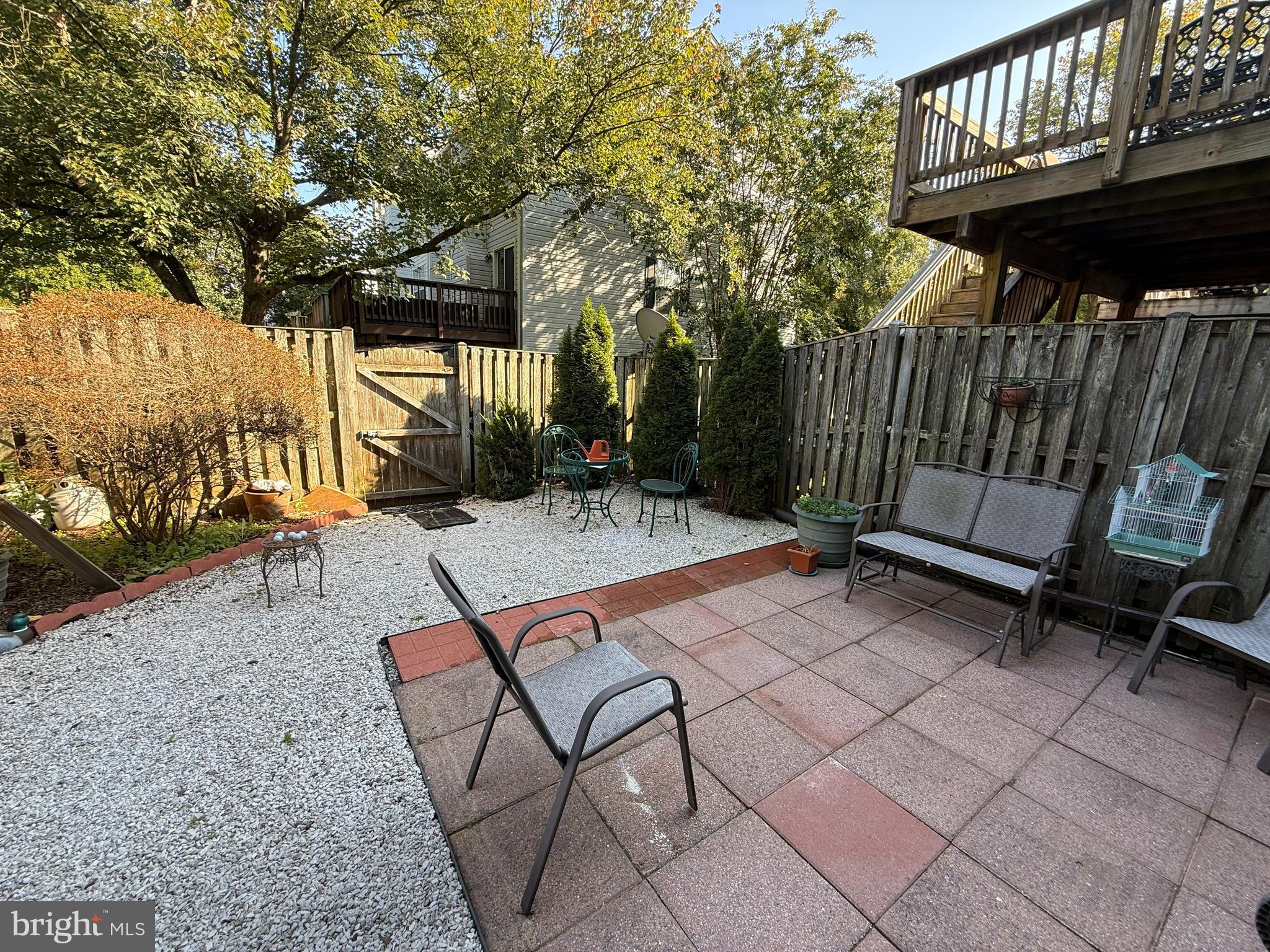 2568 Ambling Circle Crofton, MD 21114 - Photo 7 of 7 a view of backyard with a table and chairs