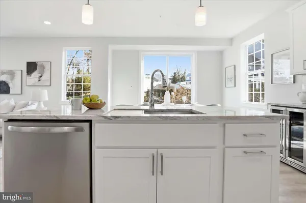 a kitchen with cabinets appliances and a counter top space