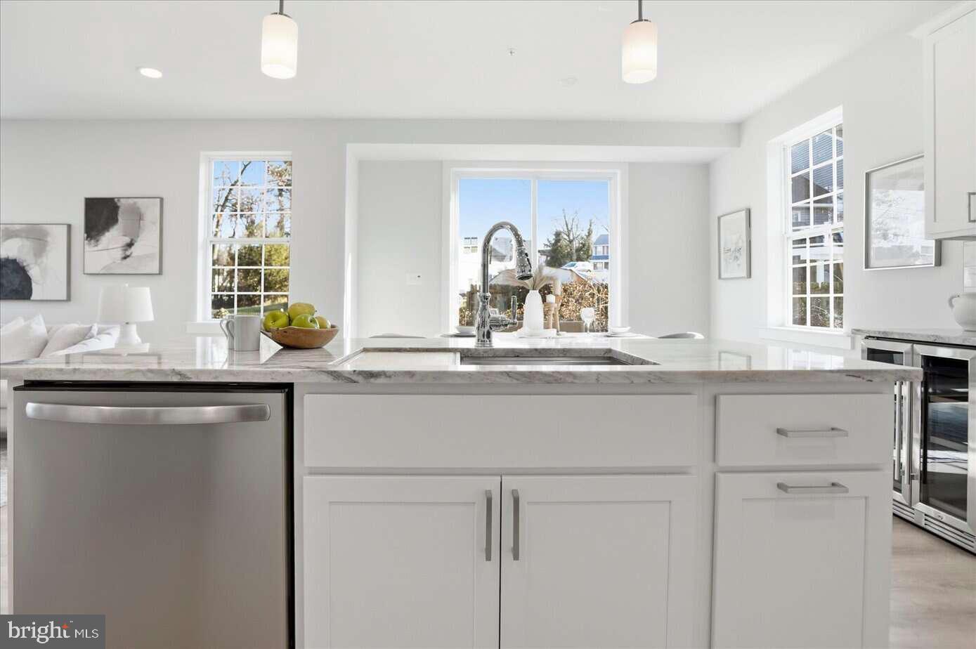533 Forest View Road Linthicum Heights, MD 21090 - Photo 11 of 20 a kitchen with cabinets appliances and a counter top space