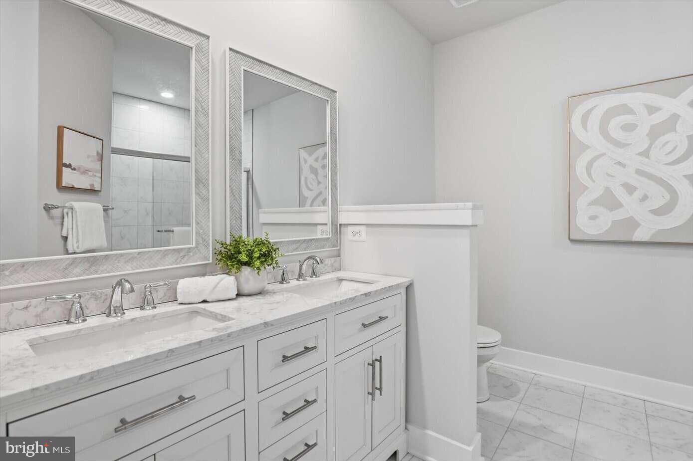 533 Forest View Road Linthicum Heights, MD 21090 - Photo 17 of 20 a bathroom with a sink and a mirror