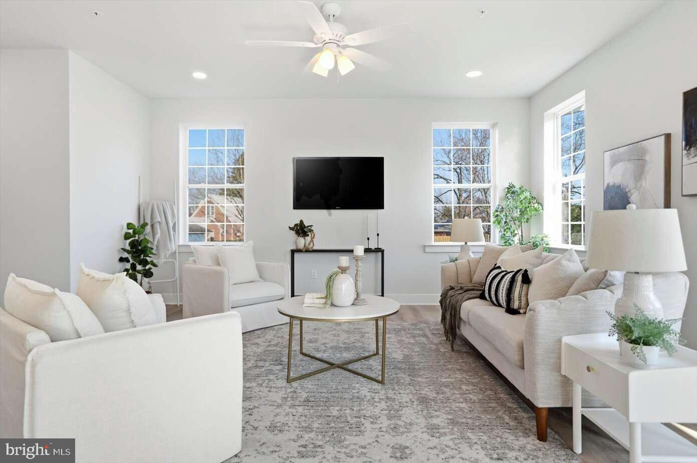 533 Forest View Road Linthicum Heights, MD 21090 - Photo 5 of 20 a living room with furniture and a flat screen tv
