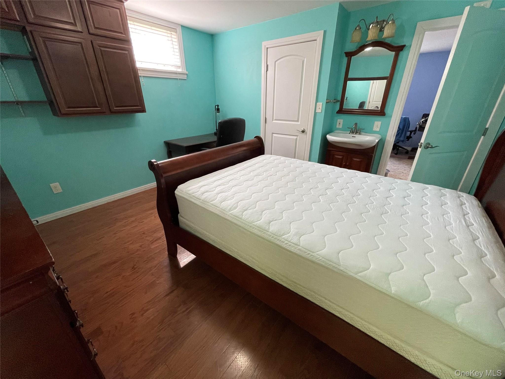 419 Triphammer Road Ithaca, NY 14850 - Photo 13 of 26 a bed sitting in a bedroom next to a window