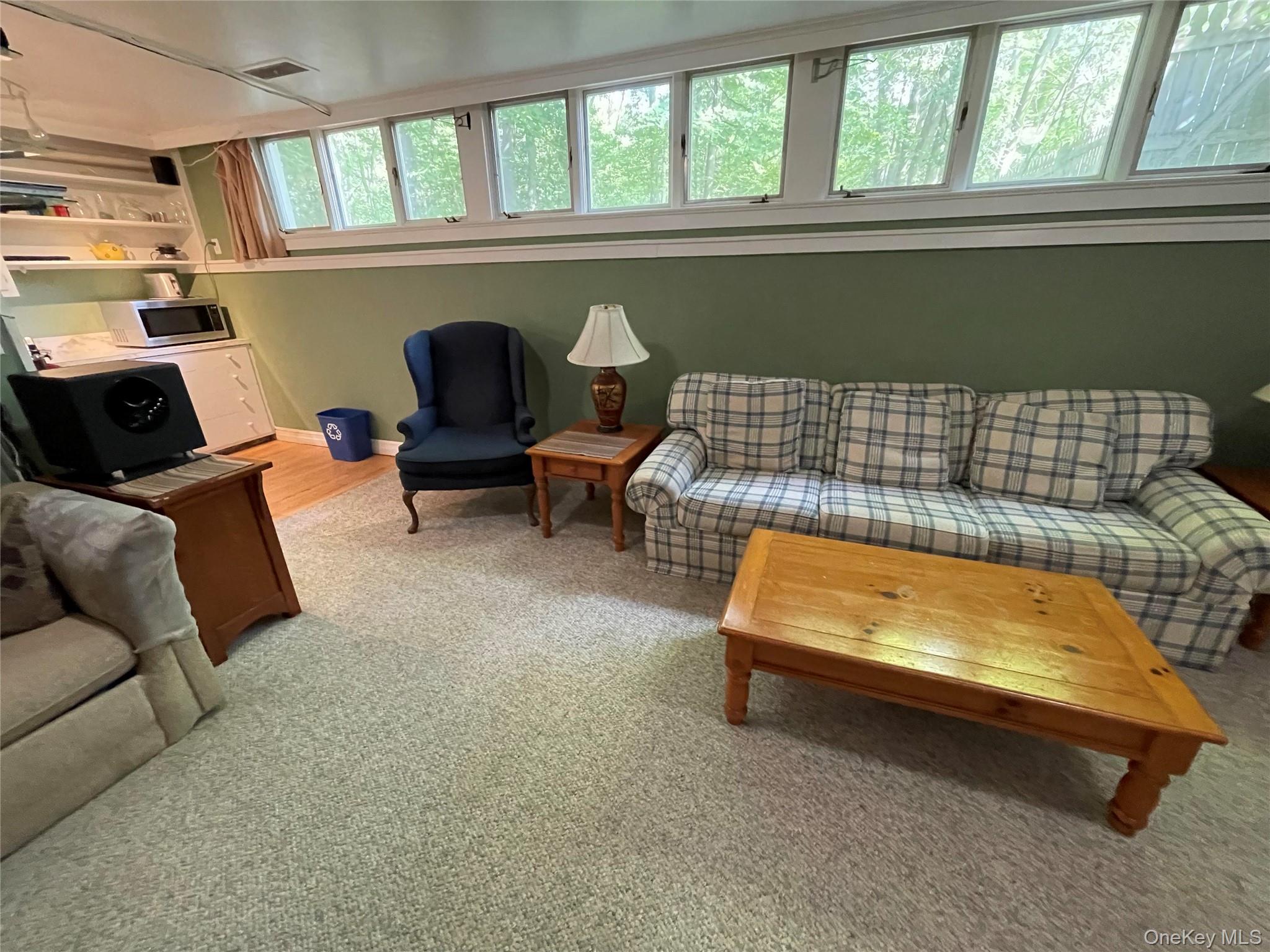 419 Triphammer Road Ithaca, NY 14850 - Photo 14 of 26 a living room with furniture and a window