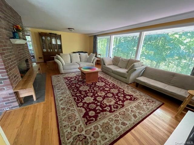419 Triphammer Road Ithaca, NY 14850 - Photo 15 of 26 a living room with furniture and a large window