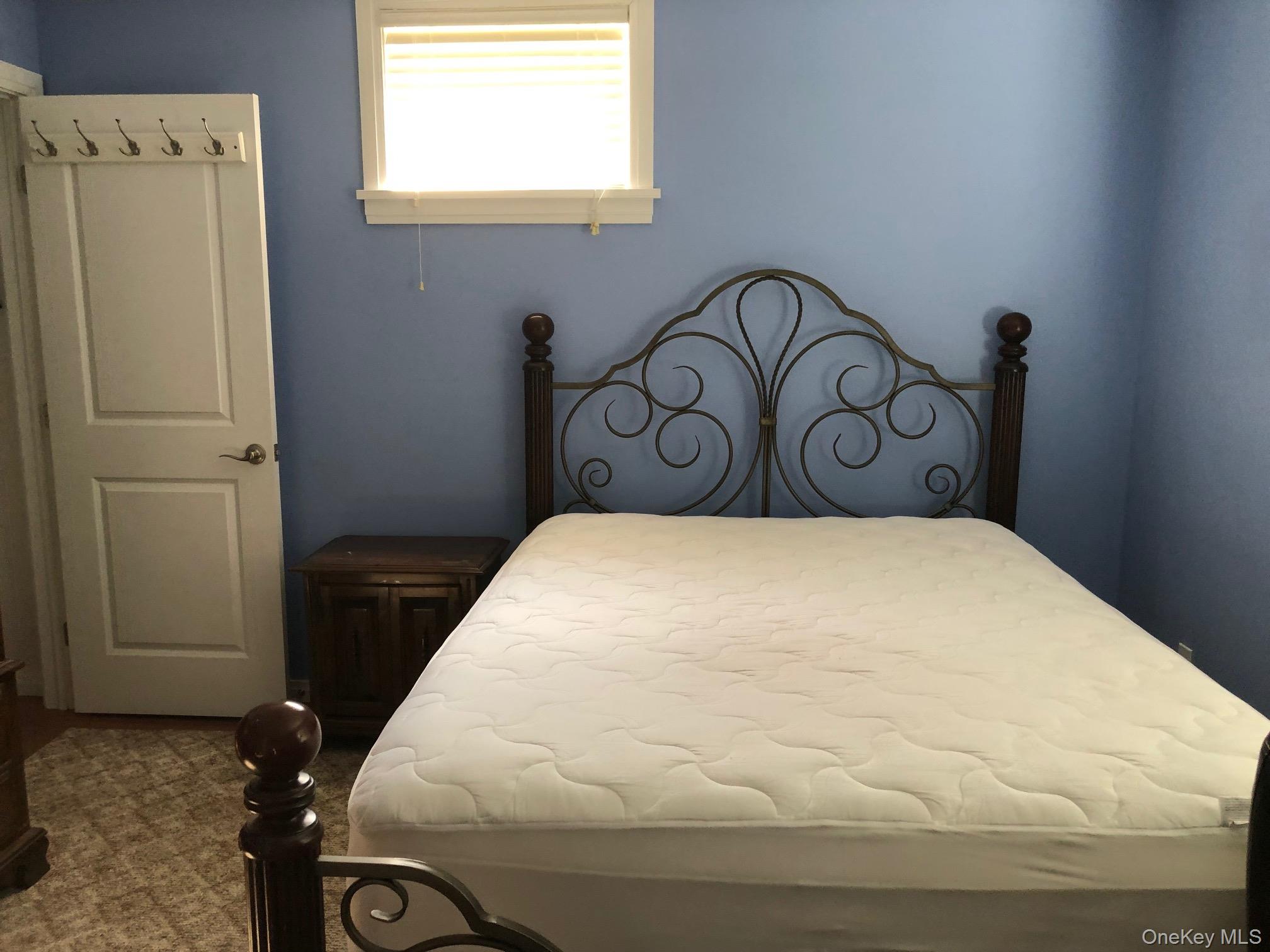 419 Triphammer Road Ithaca, NY 14850 - Photo 21 of 26 a bedroom with a bed and a window