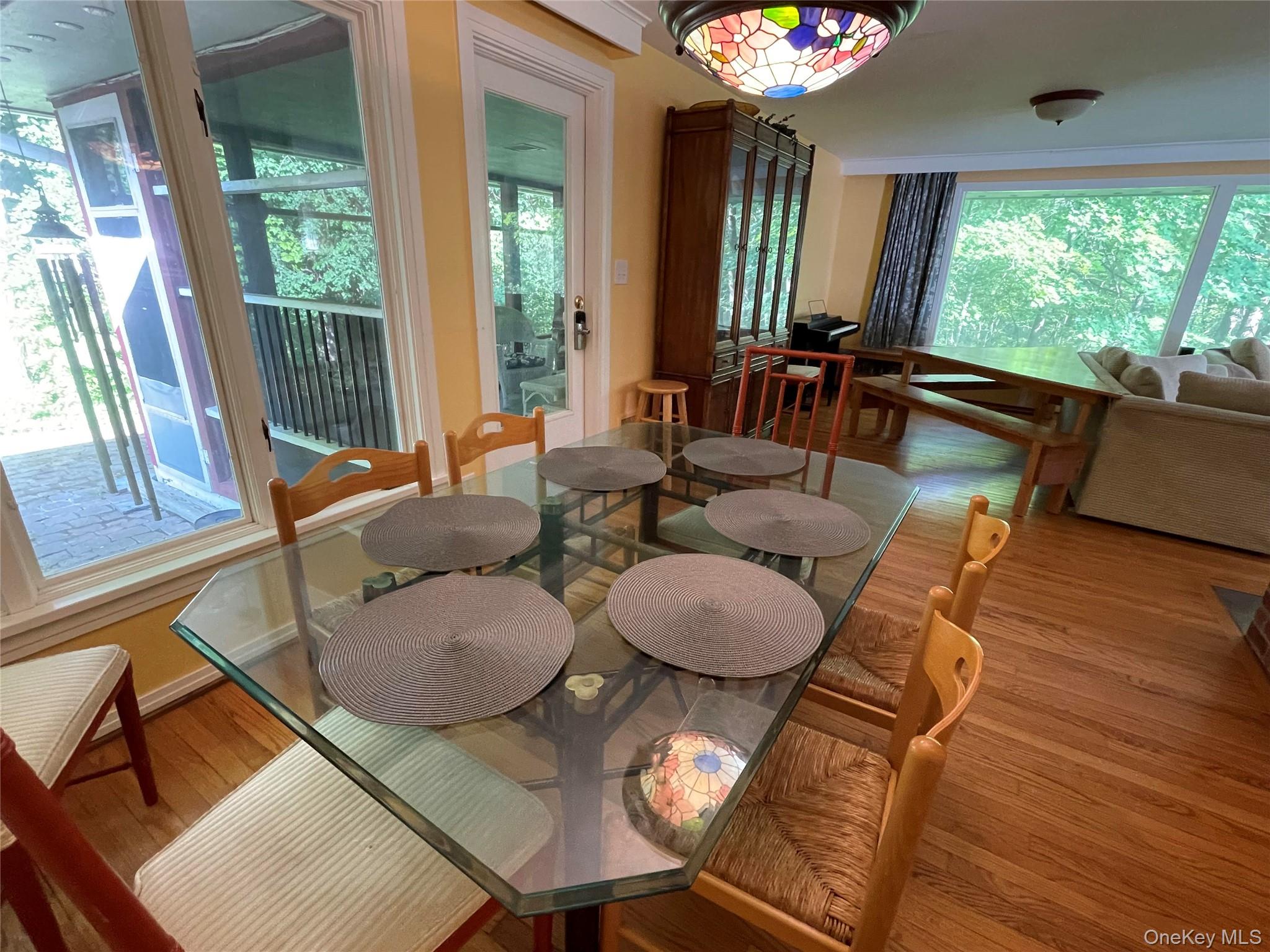 419 Triphammer Road Ithaca, NY 14850 - Photo 4 of 26 a living room with furniture and a large window