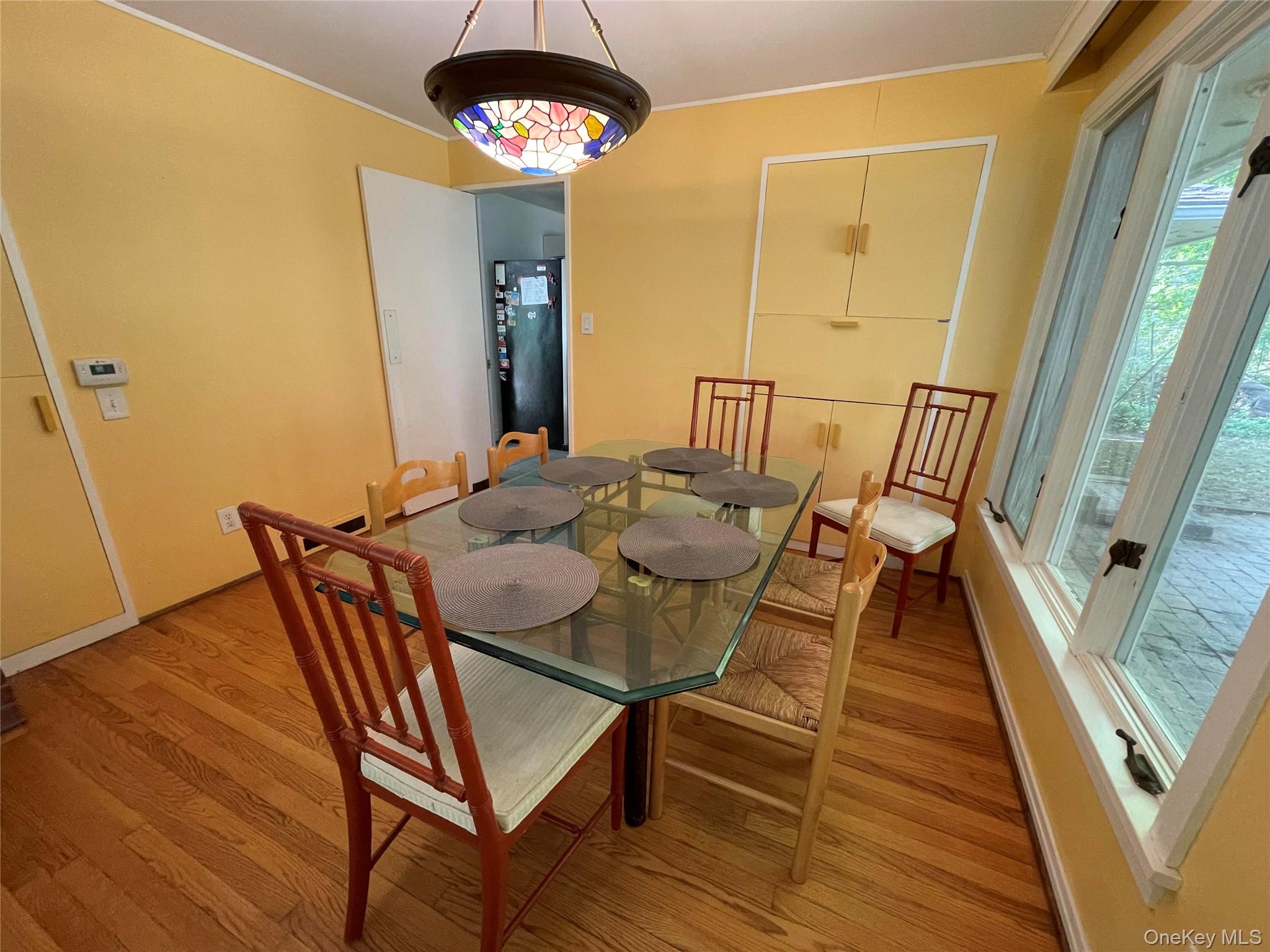 419 Triphammer Road Ithaca, NY 14850 - Photo 8 of 26 a view of a dining room with furniture and wooden floor