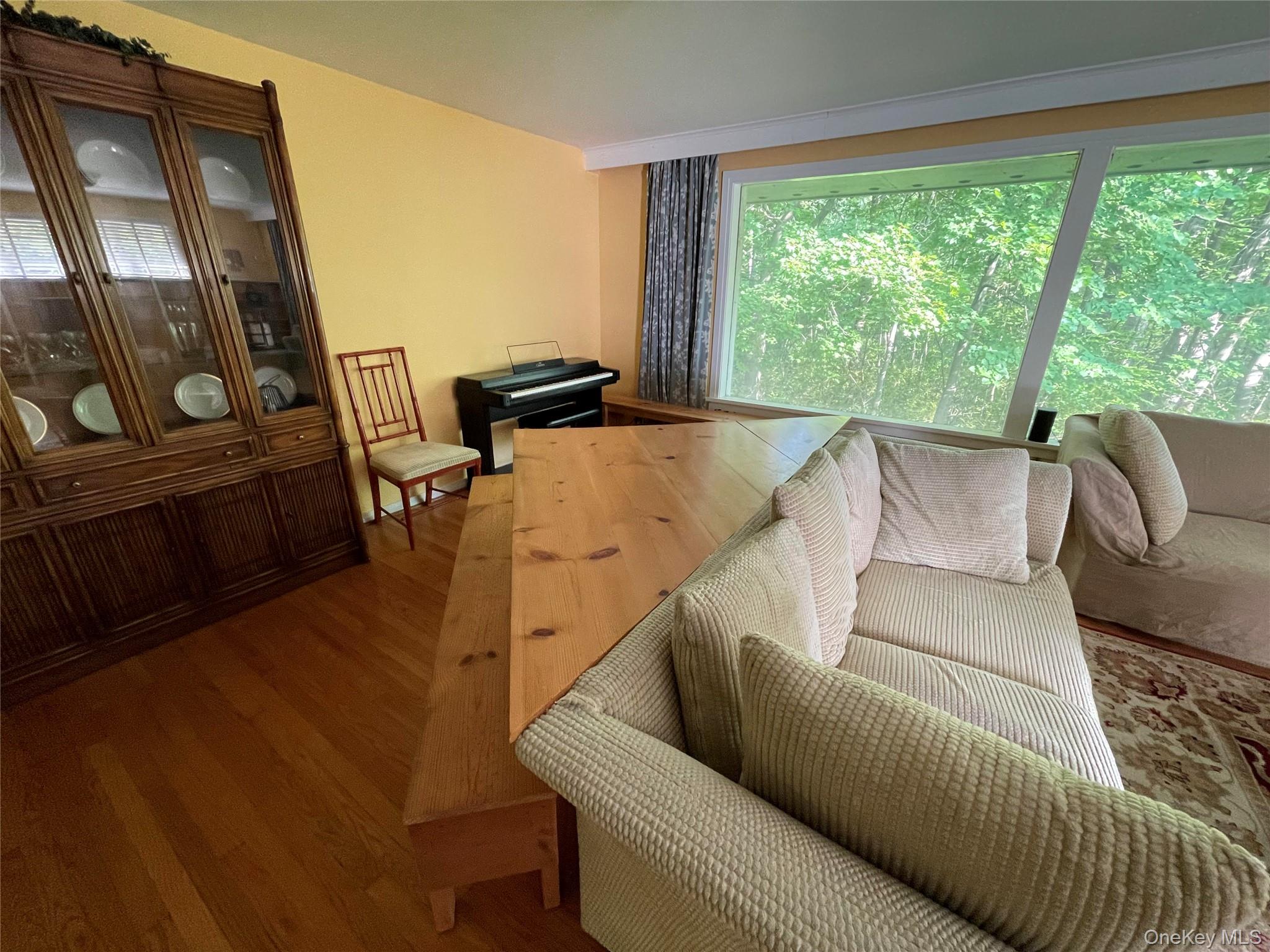 419 Triphammer Road Ithaca, NY 14850 - Photo 9 of 26 a living room with furniture and a large window