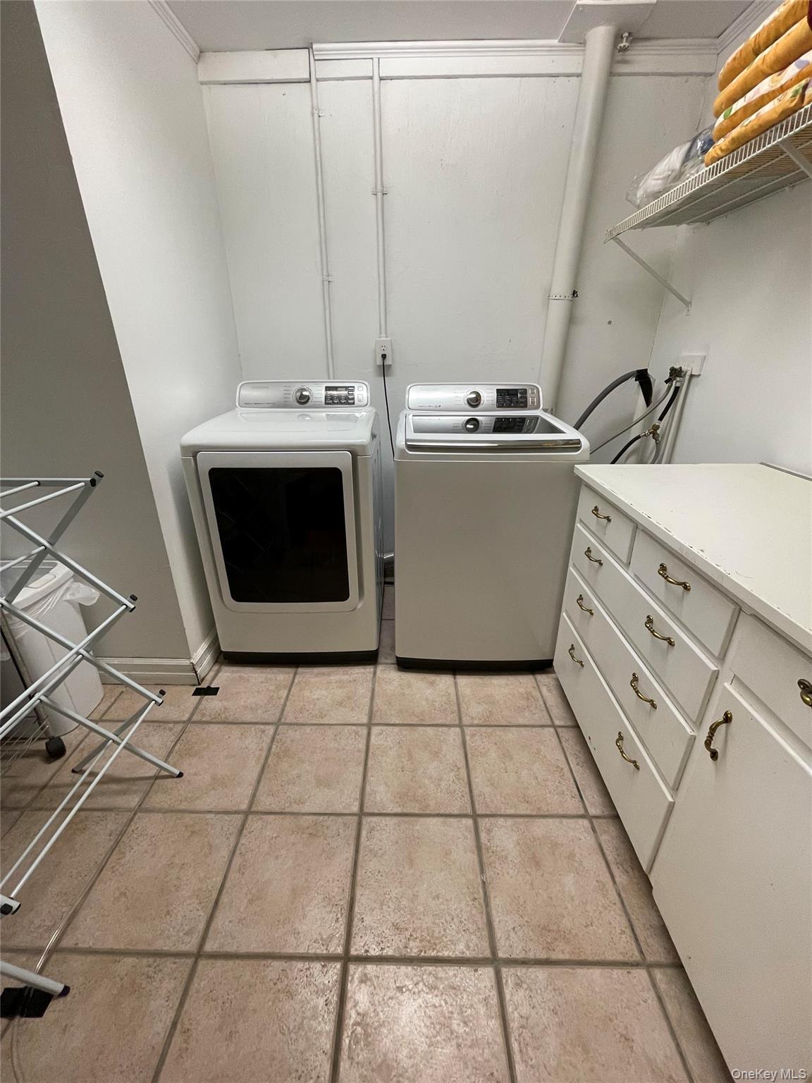 419 Triphammer Road Ithaca, NY 14850 - Photo 10 of 26 a utility room with dryer and washer