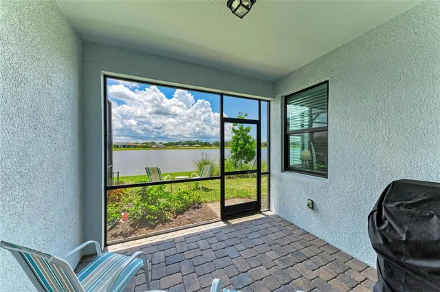 a kitchen with stainless steel appliances white cabinets and a stove a refrigerator with a sink
