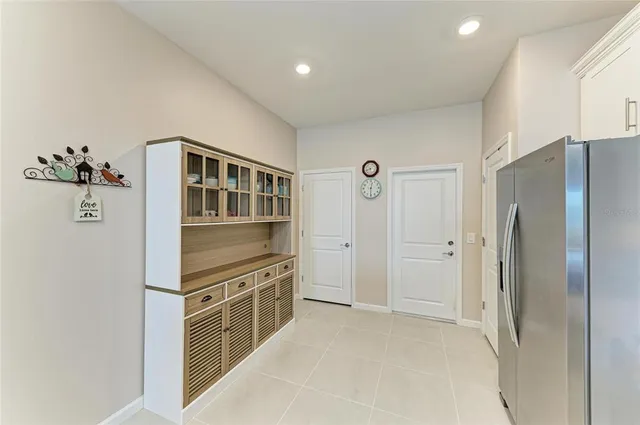 a bedroom with a bed and cabinets