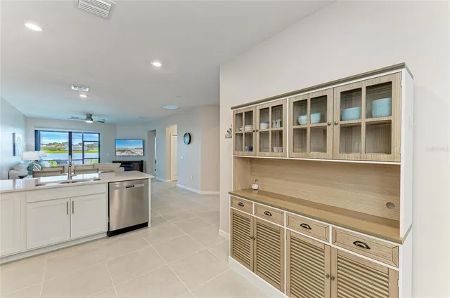 a aerial view of a house with a yard and lake view
