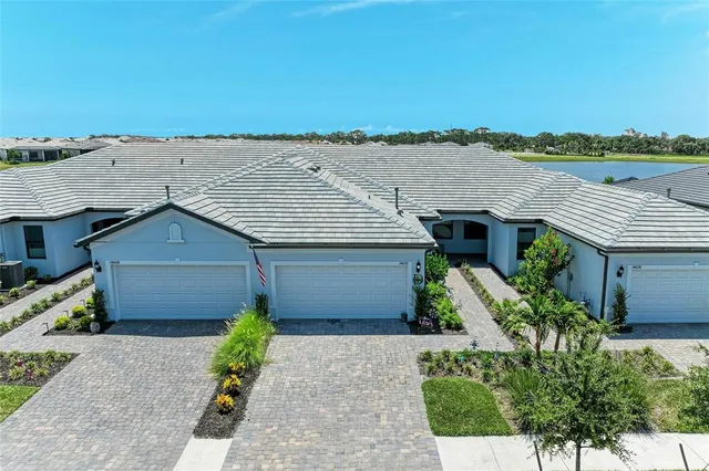 a view of a patio with a dining table and chairs with a fire pit