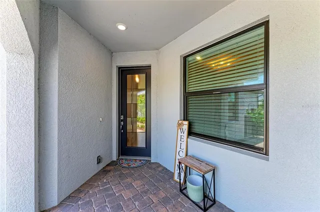a living room with furniture a ceiling fan and a rug