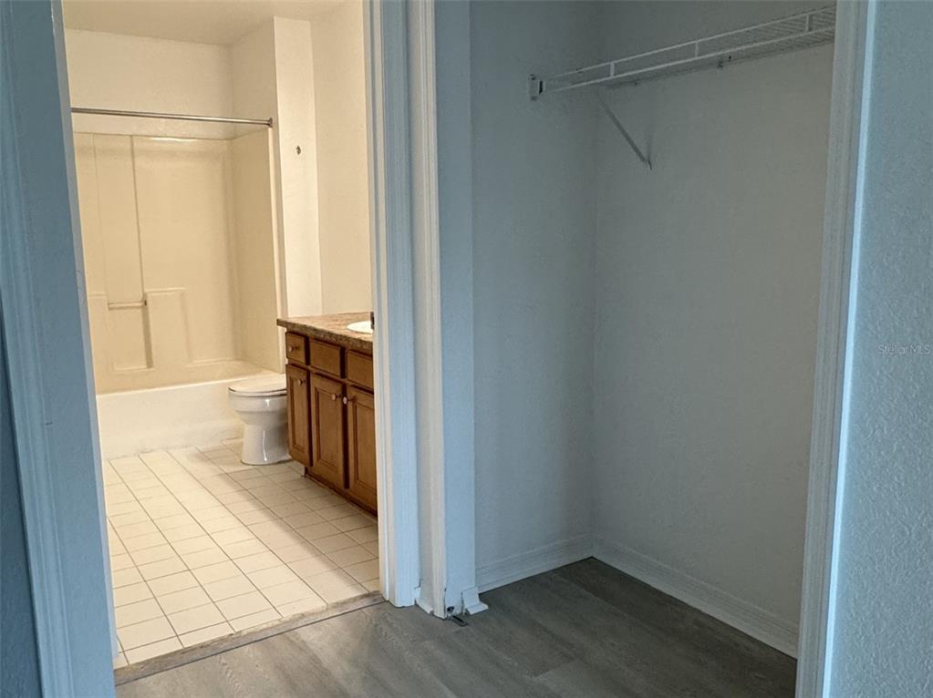 5483 Vineland Road, Unit 10201 Orlando, FL 32811 - Photo 17 of 35 a bathroom with a sink and a toilet
