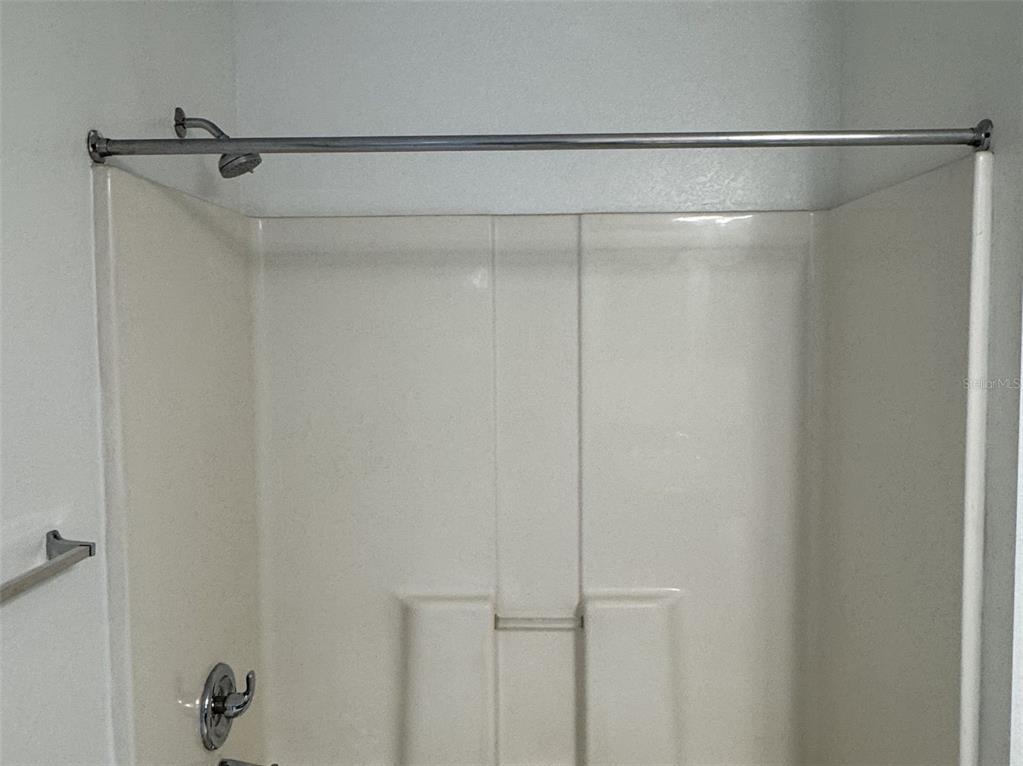 5483 Vineland Road, Unit 10201 Orlando, FL 32811 - Photo 19 of 35 a bathroom with a glass shower door