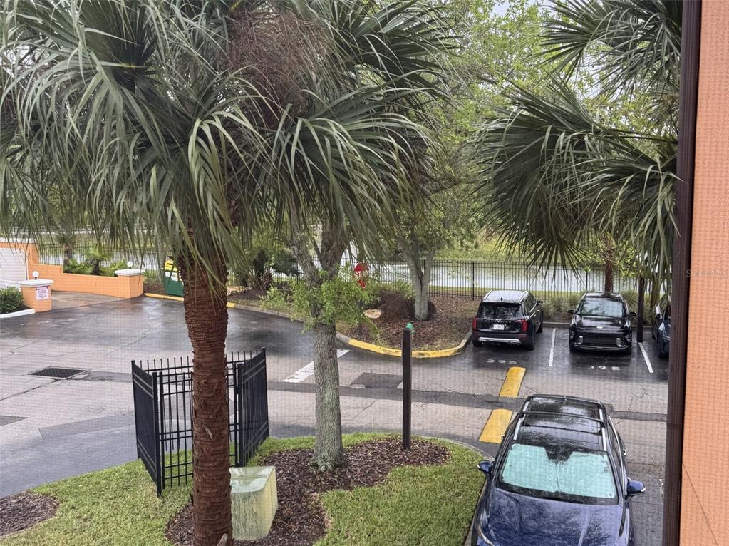 5483 Vineland Road, Unit 10201 Orlando, FL 32811 - Photo 20 of 35 a backyard of a house with table and chairs a barbeque with potted plants