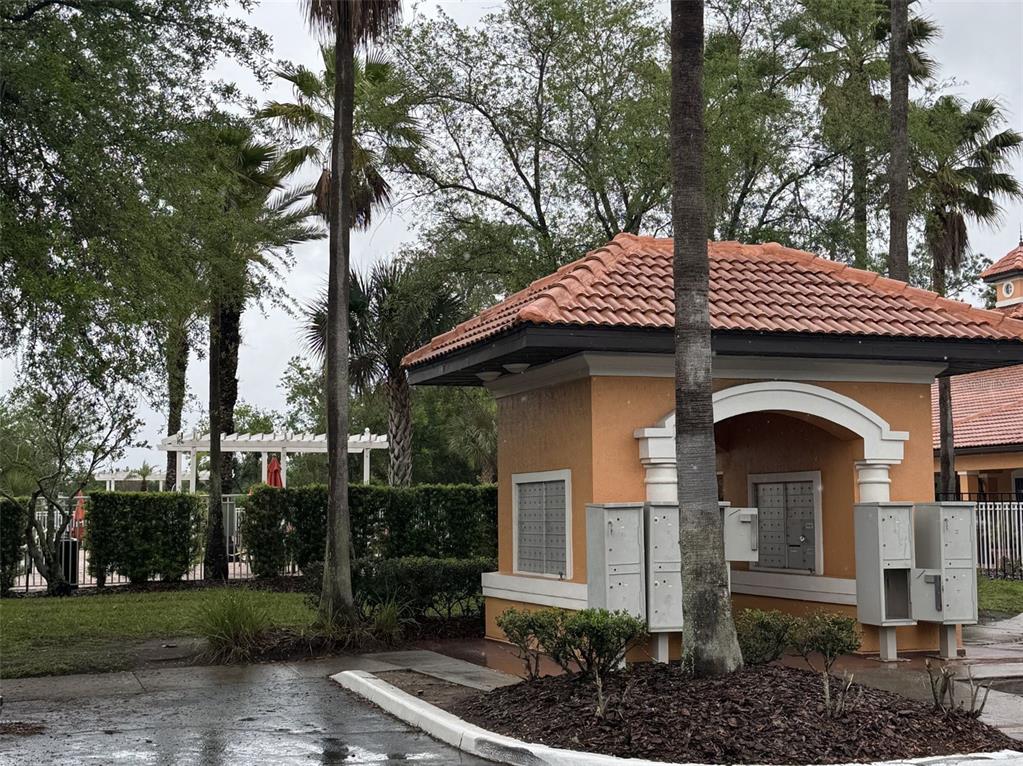 5483 Vineland Road, Unit 10201 Orlando, FL 32811 - Photo 21 of 35 a front view of a house with garden