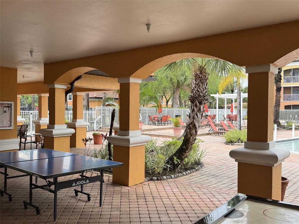 5483 Vineland Road, Unit 10201 Orlando, FL 32811 - Photo 27 of 35 a lobby with furniture and large windows
