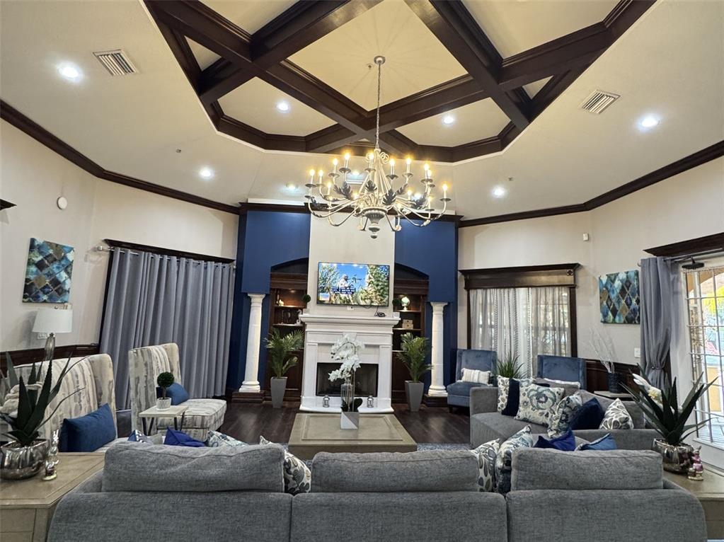 5483 Vineland Road, Unit 10201 Orlando, FL 32811 - Photo 30 of 35 a living room with fireplace furniture and a chandelier