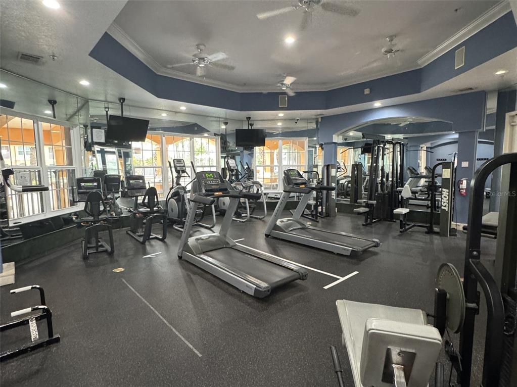 5483 Vineland Road, Unit 10201 Orlando, FL 32811 - Photo 33 of 35 a view of a room with gym equipment