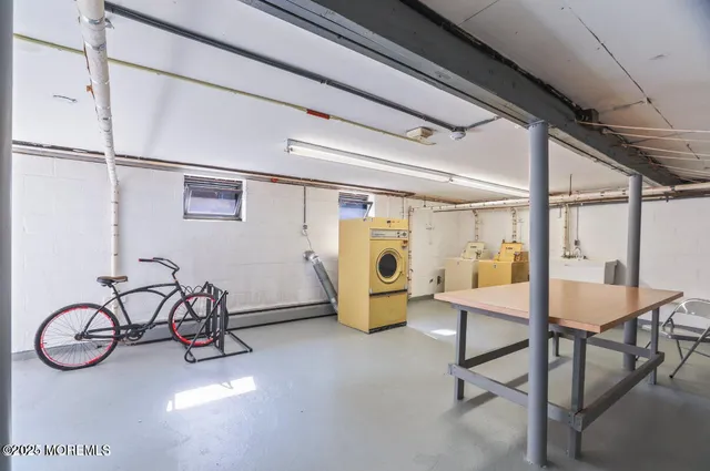 a view of a livingroom with furniture and a window