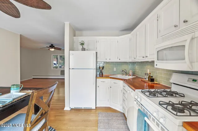 a kitchen with a stove a refrigerator and a stove